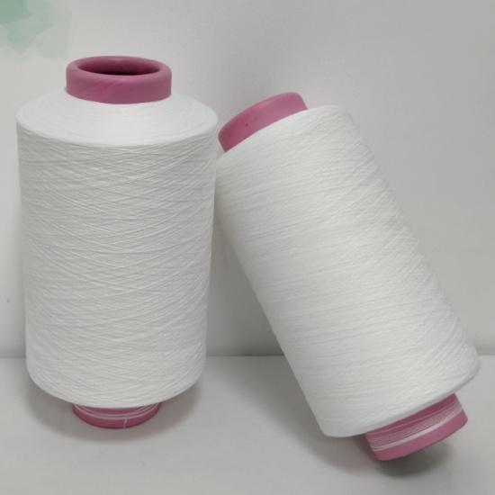 Functional cotton-like covered yarn